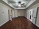 Spacious bedroom with hardwood floors and en-suite bathroom access at 2368 Misty Ivy Ct, Buford, GA 30519