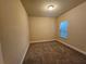 Simple bedroom with carpeted floors and a window at 2368 Misty Ivy Ct, Buford, GA 30519
