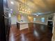 Open concept kitchen with island and hardwood floors at 2368 Misty Ivy Ct, Buford, GA 30519