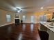 Bright living room with hardwood floors and fireplace at 2368 Misty Ivy Ct, Buford, GA 30519