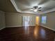 Large main bedroom with hardwood floors and en-suite bathroom at 2368 Misty Ivy Ct, Buford, GA 30519