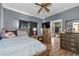 Bright bedroom featuring a ceiling fan and ample closet space at 2930 Dallas Nw St, Kennesaw, GA 30144