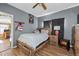 Cozy bedroom with wood flooring and ceiling fan at 2930 Dallas Nw St, Kennesaw, GA 30144