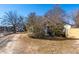 View of the house from the side yard, showing a wooden fence at 2930 Dallas Nw St, Kennesaw, GA 30144
