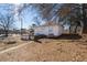 Small white house with a patio and surrounding yard at 2930 Dallas Nw St, Kennesaw, GA 30144