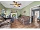 Living room with fireplace, ceiling fan, and comfy seating at 2930 Dallas Nw St, Kennesaw, GA 30144