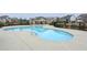 Community pool with a relaxing, free-form design and adjacent clubhouse at 5255 Austrian Pine Ct, Cumming, GA 30040