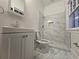 Modern bathroom with a walk-in shower, toilet, and vanity with a sink at 1089 Avon Sw Ave, Atlanta, GA 30310
