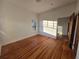 Bright bedroom with hardwood floors, large window, and warm natural lighting at 1089 Avon Sw Ave, Atlanta, GA 30310
