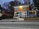 Charming two-story home at twilight with a beautifully landscaped front yard and inviting ambiance at 1089 Avon Sw Ave, Atlanta, GA 30310