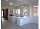 Modern kitchen featuring white cabinets, stainless steel appliances, and a breakfast bar area at 1089 Avon Sw Ave, Atlanta, GA 30310