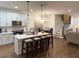 Modern kitchen with white cabinets, quartz countertops, and an island at 2708 Eagles Crest Ln, Decatur, GA 30034