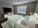 Well-lit bedroom with decorative accents and a comfortable bed at 432 Independence Dr, Jonesboro, GA 30238