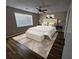 Staged bedroom showcases large window, ceiling fan, and stylish furniture at 432 Independence Dr, Jonesboro, GA 30238