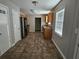 Open dining area leading to a kitchen with tile flooring and ample natural light at 432 Independence Dr, Jonesboro, GA 30238