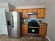 Modern kitchen featuring stainless steel appliances, granite countertops, and ample cabinet space at 432 Independence Dr, Jonesboro, GA 30238
