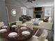 Open living space with stylish furniture, stone fireplace, and adjacent dining area at 432 Independence Dr, Jonesboro, GA 30238