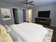 Spacious main bedroom with a large bed, TV, and multiple closets for ample storage at 432 Independence Dr, Jonesboro, GA 30238