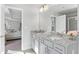 Double vanity bathroom with granite countertops and a view into the bedroom at 480 Paces Dr, Lithia Springs, GA 30122