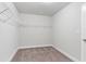 Large walk-in closet with wire shelving and carpeted flooring at 480 Paces Dr, Lithia Springs, GA 30122
