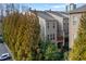 Exterior view of townhomes with mature trees, offering a blend of privacy and natural beauty at 3261 Ferncliff Ln, Atlanta, GA 30324