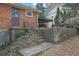 Backyard stairs leading up to a patio and fountain area at 4222 Webb Rd, Tucker, GA 30084