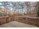 Back deck overlooking a yard with a dense tree line in the background at 6305 Holborne Ln, Douglasville, GA 30134