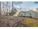 House backyard view with deck and surrounding trees at 6305 Holborne Ln, Douglasville, GA 30134