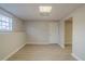 Finished basement room with wood-look floors and a door at 6305 Holborne Ln, Douglasville, GA 30134