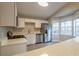 Modern kitchen with white cabinets and stainless steel appliances at 6305 Holborne Ln, Douglasville, GA 30134