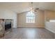 Spacious living room with stone fireplace and vaulted ceiling at 6305 Holborne Ln, Douglasville, GA 30134