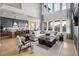 Open floor plan boasts a spacious great room, modern kitchen, and large windows at 6430 Pond View Dr, Cumming, GA 30028