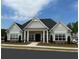 Community clubhouse with gray siding and black door at 904 Calypso Way # 904, Cumming, GA 30040