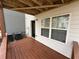 View of a home's back porch featuring wood flooring and an entrance to the home at 2912 Ashlyn Pointe Dr, Atlanta, GA 30340