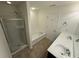 Full bathroom featuring a glass-enclosed shower, separate bathtub, and double sink vanity at 2912 Ashlyn Pointe Dr, Atlanta, GA 30340