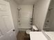 Bathroom with a shower-tub combo, toilet, and white vanity at 2912 Ashlyn Pointe Dr, Atlanta, GA 30340