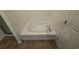 An inviting soaking tub with neutral tile surround offers relaxation in this bathroom at 2912 Ashlyn Pointe Dr, Atlanta, GA 30340
