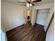 Bright bedroom with wood-look flooring and a closet with double doors at 2912 Ashlyn Pointe Dr, Atlanta, GA 30340