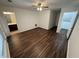 Bedroom featuring wood-look flooring, a ceiling fan, and access to an ensuite bathroom at 2912 Ashlyn Pointe Dr, Atlanta, GA 30340