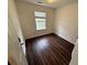 Bedroom featuring dark wood-look floors and a window at 2912 Ashlyn Pointe Dr, Atlanta, GA 30340