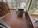 View of wooden deck featuring an outdoor grill and views of the surrounding neighborhood at 2912 Ashlyn Pointe Dr, Atlanta, GA 30340