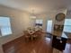 Dining area featuring hardwood floors, modern lighting and large windows at 2912 Ashlyn Pointe Dr, Atlanta, GA 30340