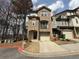 Charming brick townhome featuring attached garage and well-maintained landscaping at 2912 Ashlyn Pointe Dr, Atlanta, GA 30340