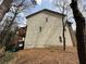 The backside of a tan two story townhome with a wooden porch at 2912 Ashlyn Pointe Dr, Atlanta, GA 30340