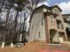 Side view of a brick townhome with vinyl siding and attached one car garage at 2912 Ashlyn Pointe Dr, Atlanta, GA 30340
