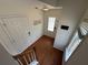View of a home's entryway featuring hardwood floors, a glass-paneled door, and a window for natural light at 2912 Ashlyn Pointe Dr, Atlanta, GA 30340