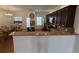 Inviting kitchen open to dining area, featuring granite counters and stainless appliances at 2912 Ashlyn Pointe Dr, Atlanta, GA 30340