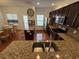 Open kitchen with granite counters, island, stainless steel appliances, and breakfast bar at 2912 Ashlyn Pointe Dr, Atlanta, GA 30340