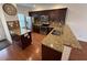 Modern kitchen features granite countertops, stainless appliances, and hardwood floors at 2912 Ashlyn Pointe Dr, Atlanta, GA 30340