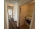 View of the laundry room with a front-loading washing machine and shelving at 2912 Ashlyn Pointe Dr, Atlanta, GA 30340
